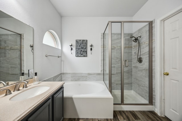 10602 Greenbriar Ln, Rowlett, TX 75089 - full bathroom with vanity, a bath, wood finished floors, and a shower stall
