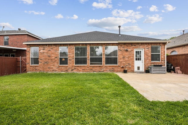 10602 Greenbriar Ln, Rowlett, TX 75089 - back of house with a shingled roof, brick siding, a fenced backyard, a patio area, and a lawn