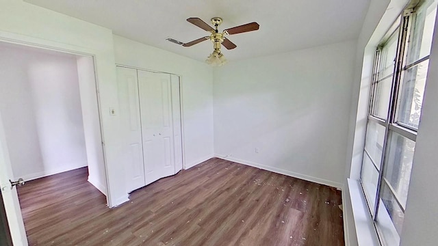 700 N Scarlett Dr, Lacy Lakeview, TX 76705 - unfurnished bedroom with visible vents, a ceiling fan, and wood finished floors