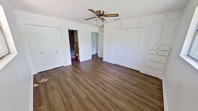 700 N Scarlett Dr, Lacy Lakeview, TX 76705 - unfurnished bedroom with visible vents, a ceiling fan, and wood finished floors