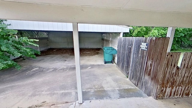 700 N Scarlett Dr, Lacy Lakeview, TX 76705 - view of patio / terrace featuring fence and a carport