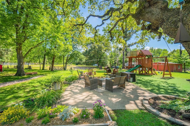 view of patio featuring an outdoor living space and a playground