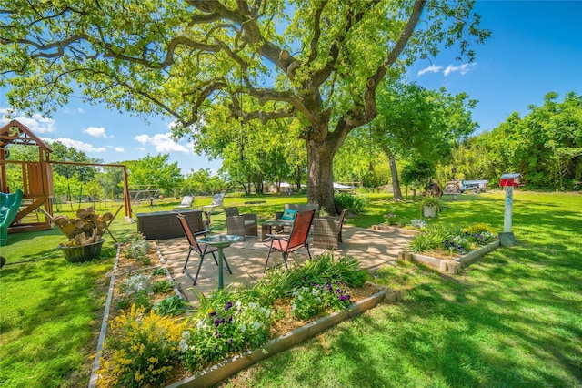 exterior space with a playground and a patio area