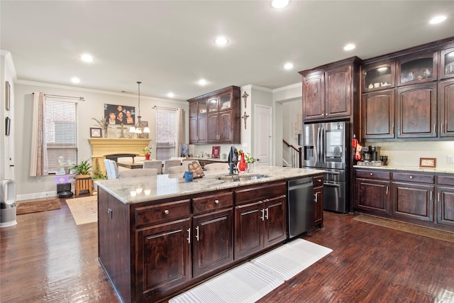 8225 Bonny Bank, The Colony, TX 75056 - kitchen with a sink, stainless steel appliances, ornamental molding, glass insert cabinets, and dark wood-style flooring