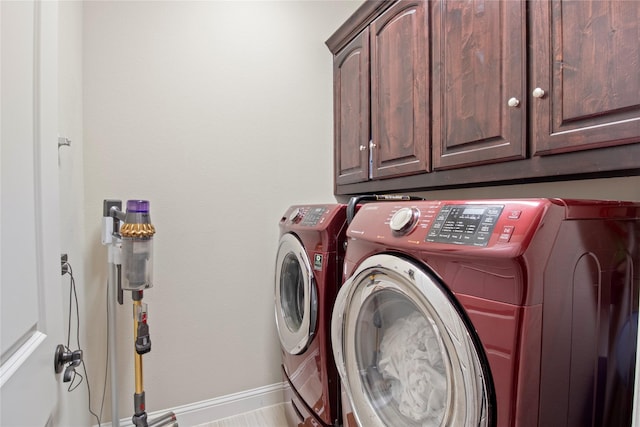 8225 Bonny Bank, The Colony, TX 75056 - laundry area with cabinet space, washing machine and clothes dryer, and baseboards