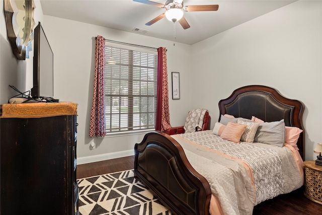 8225 Bonny Bank, The Colony, TX 75056 - bedroom with baseboards, wood finished floors, multiple windows, and ceiling fan