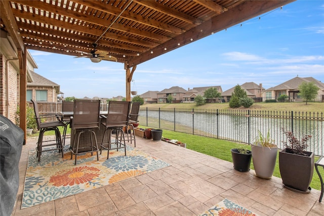 8225 Bonny Bank, The Colony, TX 75056 - view of patio / terrace featuring a residential view, a ceiling fan, and a water view