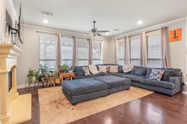 8225 Bonny Bank, The Colony, TX 75056 - living room with wood finished floors, ceiling fan, crown molding, recessed lighting, and baseboards
