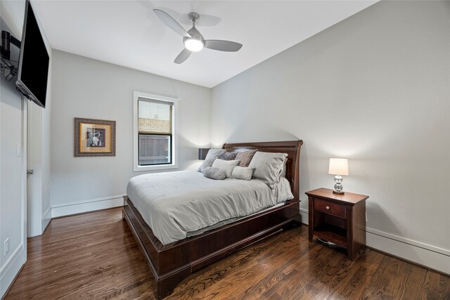 bedroom featuring baseboards, ceiling fan, and wood finished floors