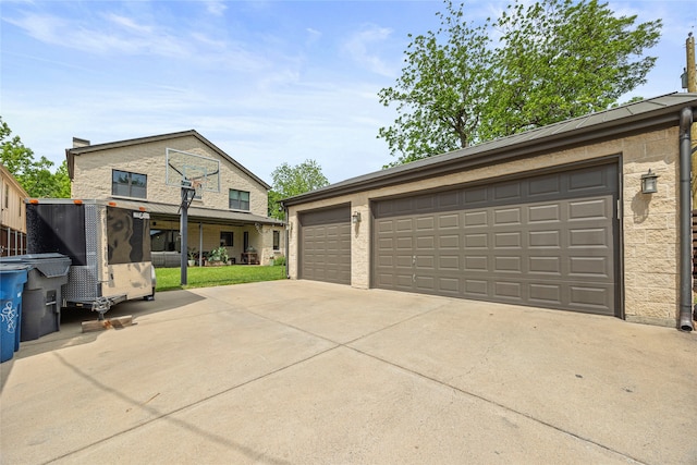 view of front of house featuring concrete driveway and a garage