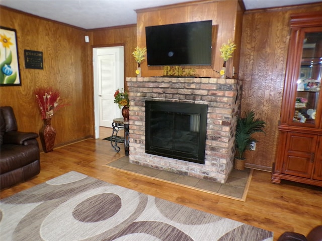 6905 Heritage Ln, Fort Worth, TX 76134 - living area with wood walls, wood finished floors, and a fireplace