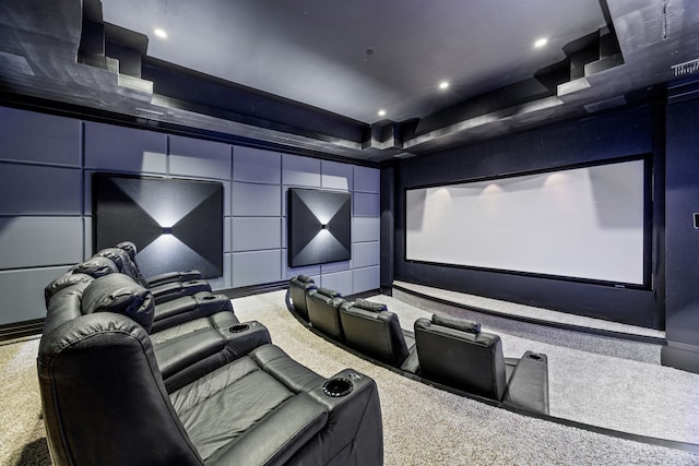 cinema with recessed lighting, a raised ceiling, and carpet