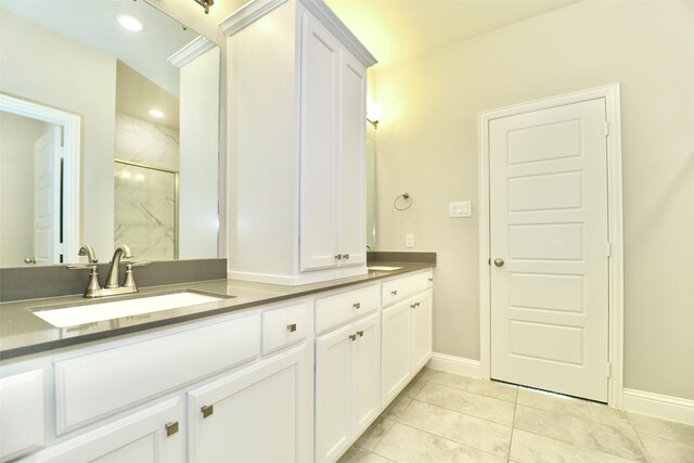 4713 Piedras Lanzar Dr, Mckinney, TX 75070 - full bath with double vanity, a sink, baseboards, a marble finish shower, and recessed lighting