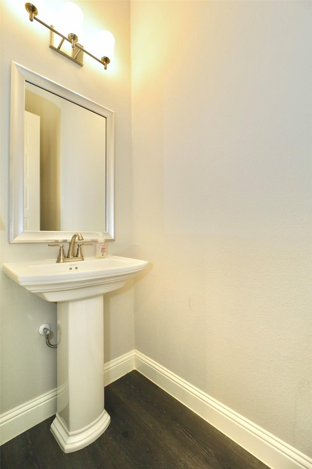 4713 Piedras Lanzar Dr, Mckinney, TX 75070 - bathroom with a sink, baseboards, and wood finished floors