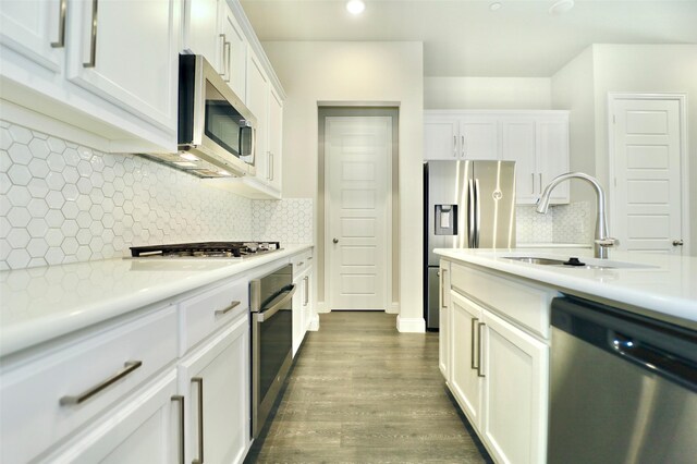 4713 Piedras Lanzar Dr, Mckinney, TX 75070 - kitchen featuring decorative backsplash, a sink, light countertops, stainless steel appliances, and white cabinetry