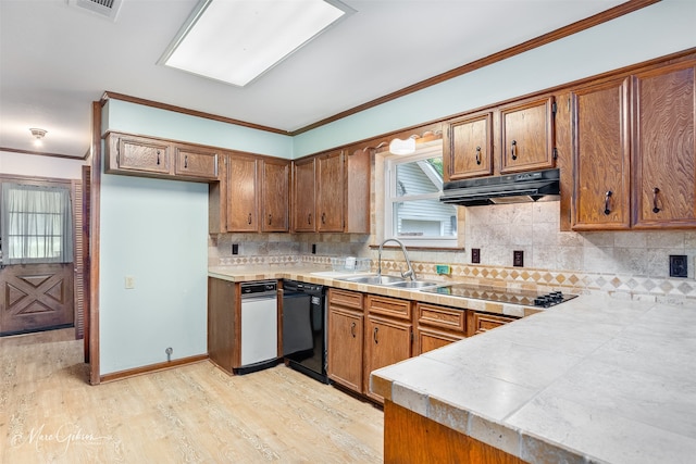 5220 Linton Cutoff Rd, Benton, LA 71006 - kitchen with a sink, under cabinet range hood, brown cabinets, and black appliances