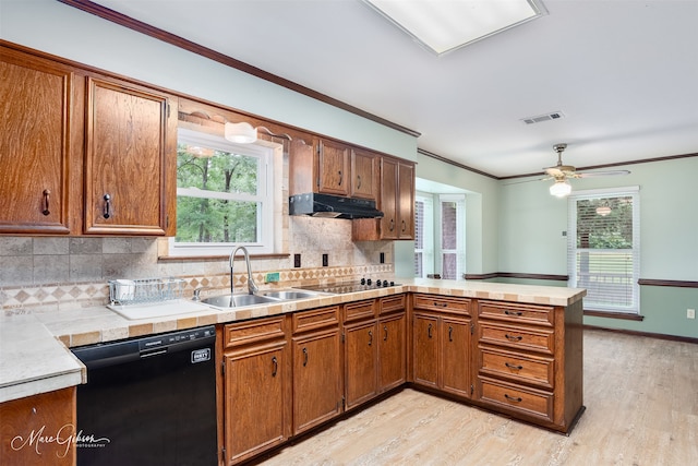 5220 Linton Cutoff Rd, Benton, LA 71006 - kitchen with crown molding, a peninsula, under cabinet range hood, visible vents, and black appliances