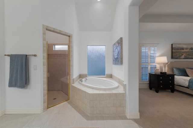 bathroom with a stall shower, ensuite bath, a garden tub, and a wealth of natural light