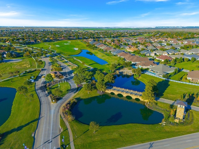 birds eye view of property with a water view and a residential view