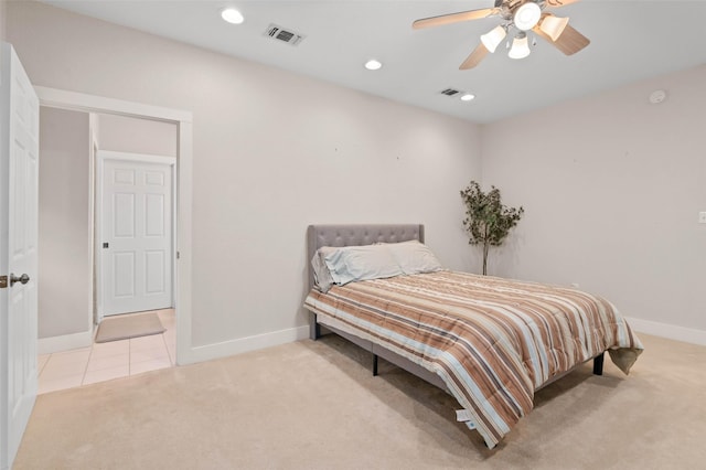carpeted bedroom with visible vents and baseboards