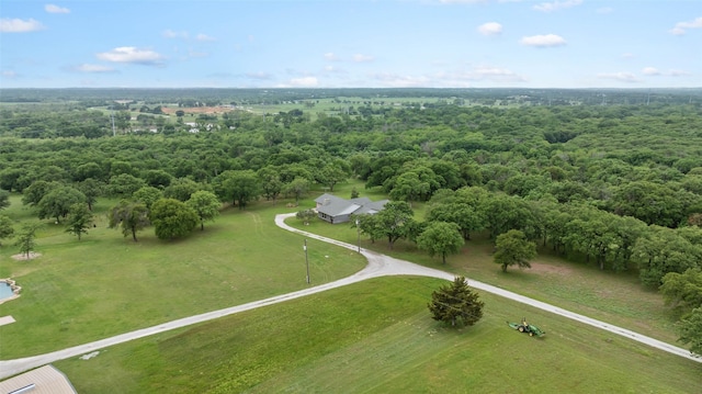 bird's eye view featuring a wooded view