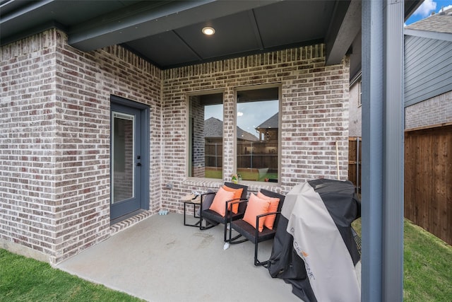 view of patio featuring fence