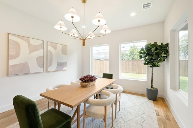 3920 Davila Dr, Dallas, TX 75220 - dining area with a chandelier, plenty of natural light, light wood-type flooring, and recessed lighting