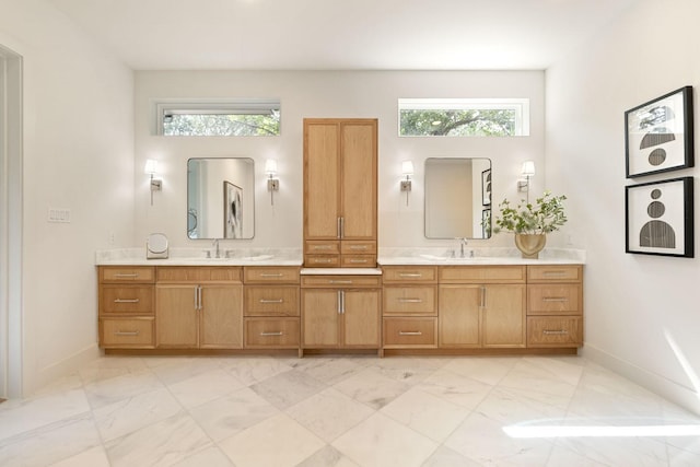 3920 Davila Dr, Dallas, TX 75220 - bathroom with marble finish floors, double vanity, and baseboards