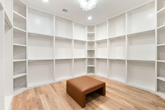 3920 Davila Dr, Dallas, TX 75220 - walk in closet featuring wood finished floors