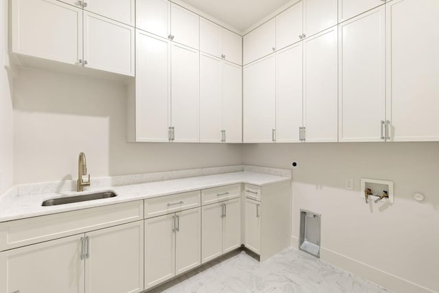 3920 Davila Dr, Dallas, TX 75220 - laundry area with cabinet space, electric dryer hookup, hookup for a washing machine, hookup for a gas dryer, and light marble finish floors