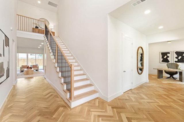 3920 Davila Dr, Dallas, TX 75220 - entrance foyer featuring stairway, baseboards, a high ceiling, and recessed lighting