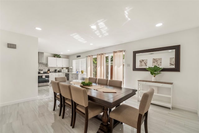dining room featuring baseboards, recessed lighting, and visible vents