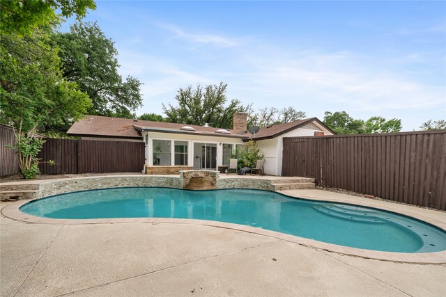 view of pool with a fenced in pool, a fenced backyard, and a patio area