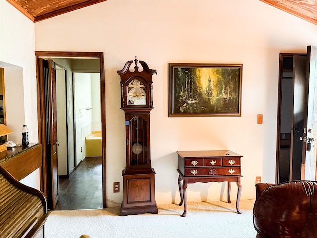 hall featuring crown molding, carpet, wood ceiling, and lofted ceiling