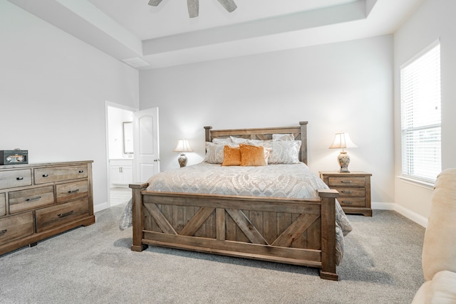 426 Norbury Dr, Rockwall, TX 75032 - bedroom featuring baseboards, a raised ceiling, a ceiling fan, carpet, and ensuite bath