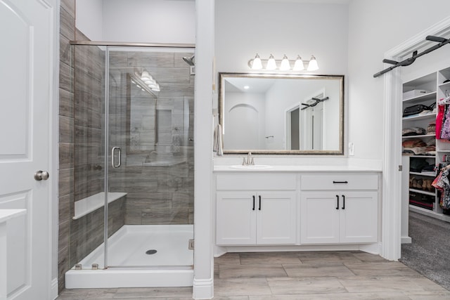 426 Norbury Dr, Rockwall, TX 75032 - full bath featuring vanity, a stall shower, wood finished floors, and a spacious closet