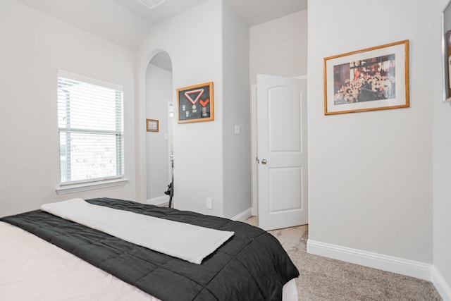 426 Norbury Dr, Rockwall, TX 75032 - bedroom featuring arched walkways, baseboards, visible vents, and light colored carpet