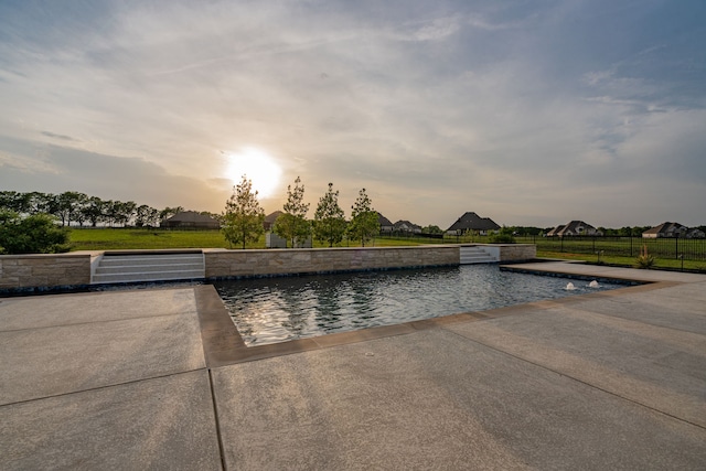 426 Norbury Dr, Rockwall, TX 75032 - pool at dusk featuring fence