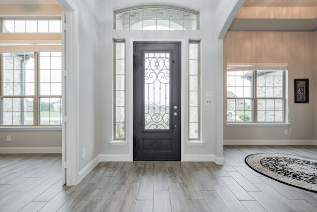 426 Norbury Dr, Rockwall, TX 75032 - entryway featuring arched walkways, baseboards, and light wood-style flooring