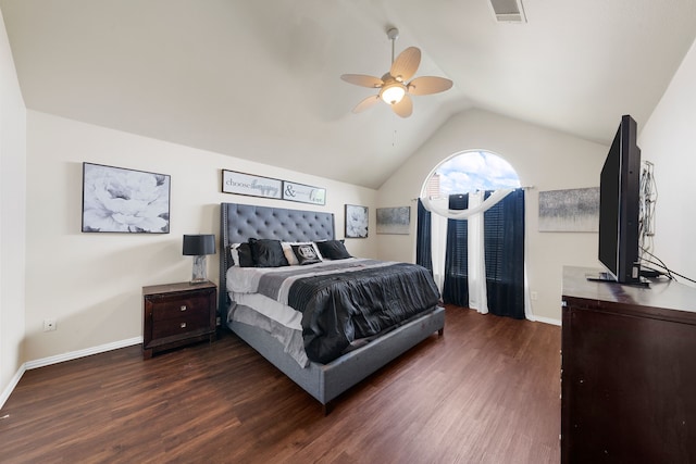 bedroom featuring baseboards, visible vents, wood finished floors, and lofted ceiling