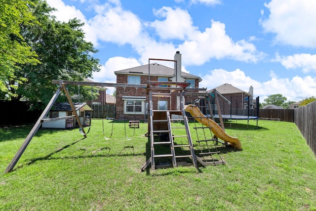 view of playground with a lawn, a fenced backyard, and a trampoline