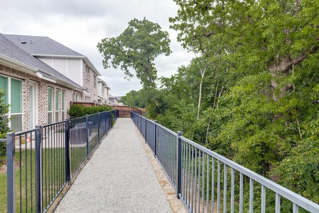 view of community featuring fence