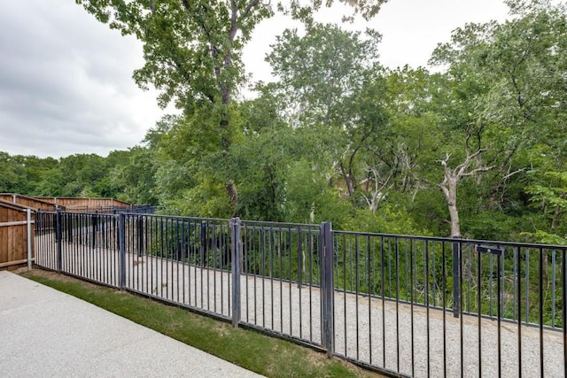 view of gate with fence
