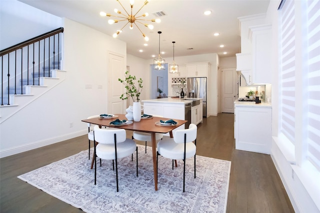 3720 Coldstream Dr, Irving, TX 75063 - dining area with an inviting chandelier, recessed lighting, stairs, and dark wood-style floors