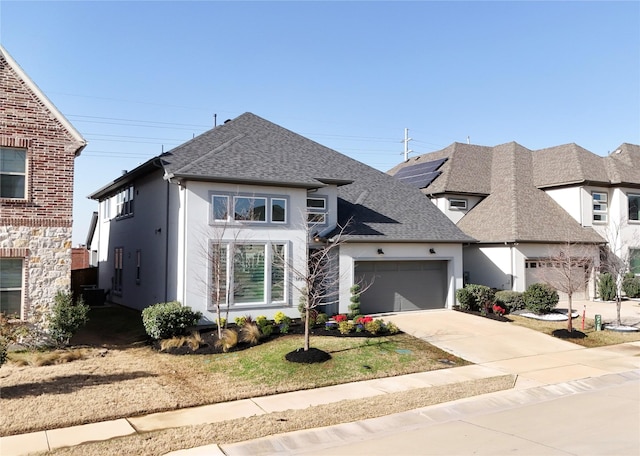 3720 Coldstream Dr, Irving, TX 75063 - view of front facade featuring roof with shingles, a front lawn, a garage, stucco siding, and driveway