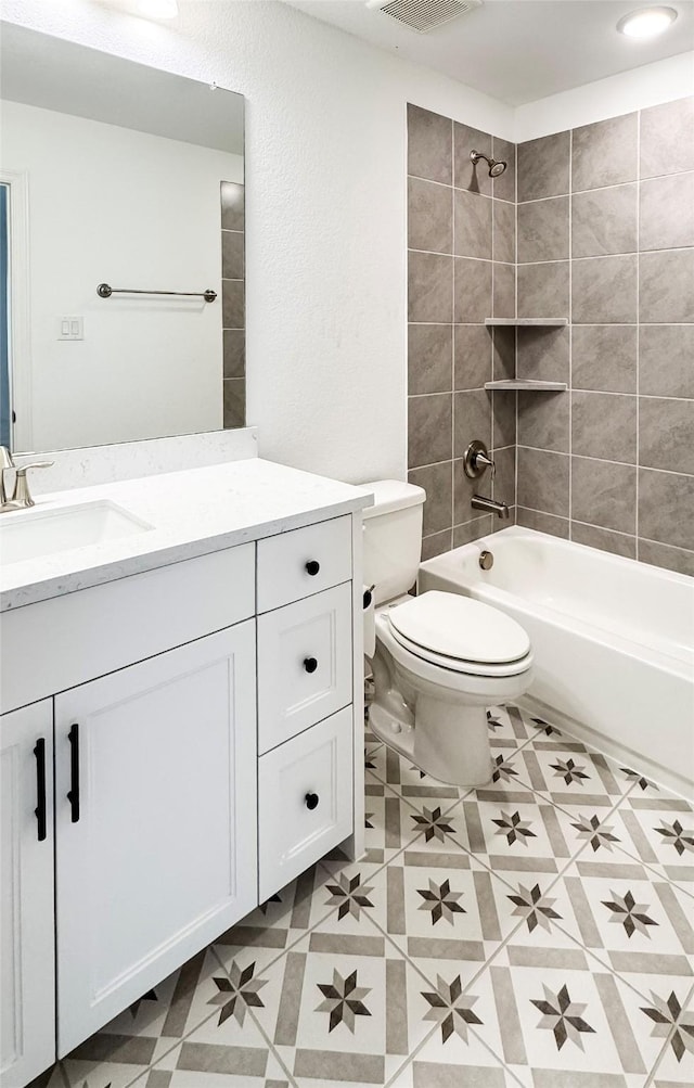 3720 Coldstream Dr, Irving, TX 75063 - bathroom featuring tile patterned flooring, vanity, toilet,  shower combination, and visible vents