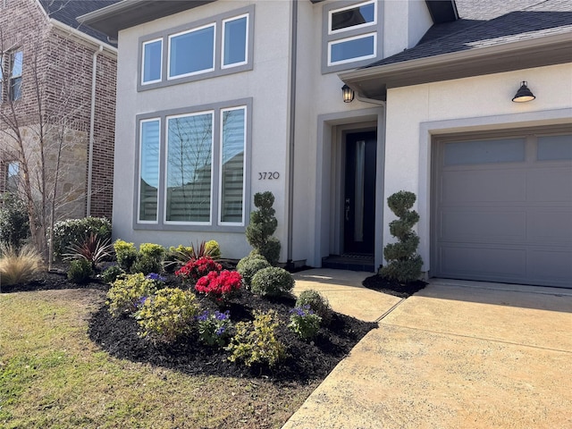 3720 Coldstream Dr, Irving, TX 75063 - view of exterior entry featuring an attached garage and stucco siding