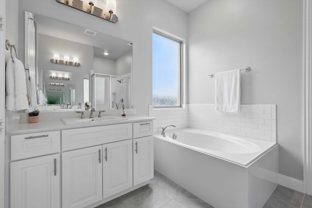 full bathroom with vanity, tile patterned flooring, a stall shower, and a garden tub