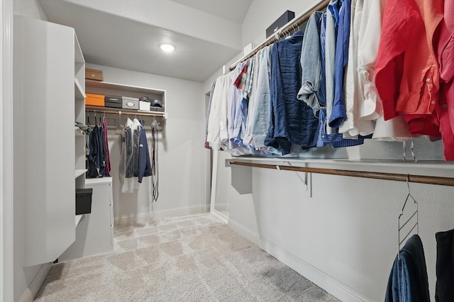 walk in closet featuring carpet