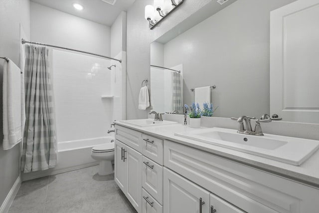 bathroom featuring a sink, shower / bath combo with shower curtain, toilet, and double vanity